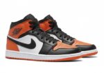 Nike Air Jordan 1 Mid in the Starfish/White/Black colorway - Image 2