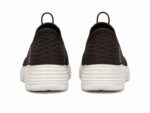 Skechers slip-in walking shoes in black with a white midsole. - Image 4